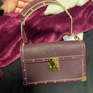 Louis Vuitton purple hand bag.